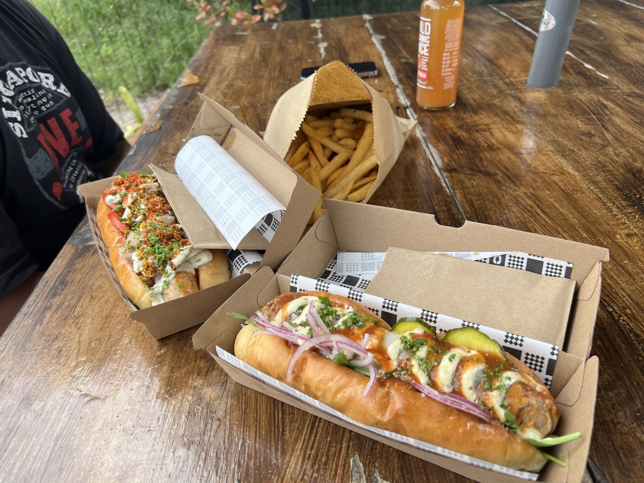 The "OB" Original Banger (beef and pork longonisa sausage  with rocket, house pickles, crunchy spanish onion, provolone cheese, tomato chilli compote & homemade Pale Ale mustard mayo, encased on a seriously soft Hoagie Roll) (front) @ The Banger Rebellion (Ettalong Beach)